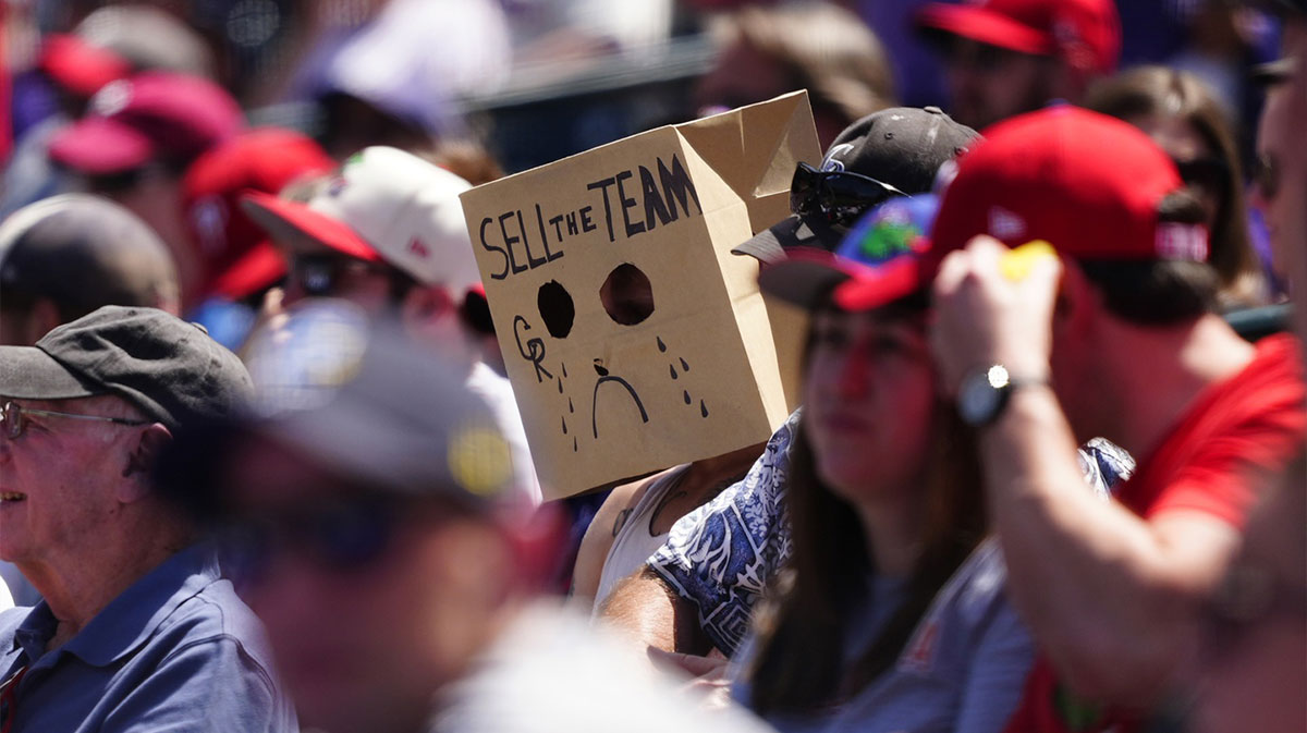 Colorado Rockies fan wears a sell the team bag during the sixth inning against the Philadelphia Phillies at Coors Field.