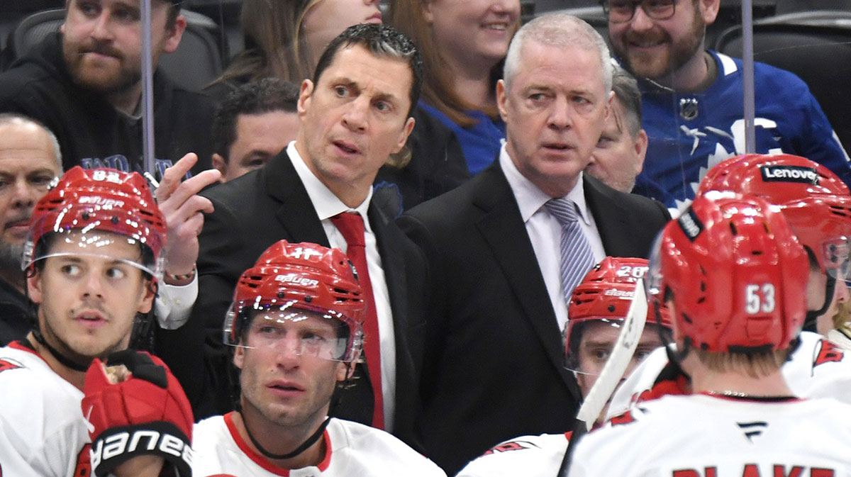 Carolina Hurricanes head coach Rod Brind'Amour gestures as he speaks to his players and assistant coach Jeff Daniels in the third period against the Toronto Maple Leafs at Scotiabank Arena.