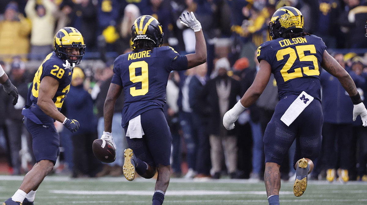 Michigan Wolverines defensive back Rod Moore (9) celebrates after he makes an interception in the second half against the Ohio State Buckeyes at Michigan Stadium.