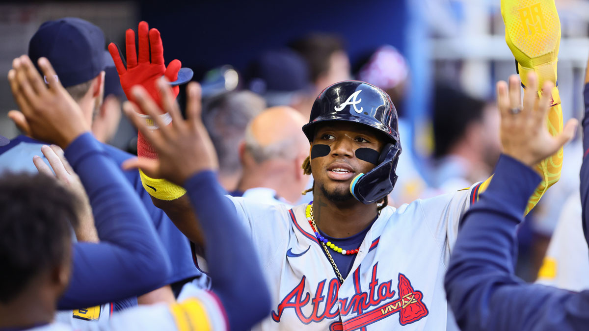 Apr 14, 2024; Miami, Florida, USA; Atlanta Braves right fielder Ronald Acuna Jr. (13) celebrates after scoring against the Miami Marlins during the ninth inning at loanDepot Park.