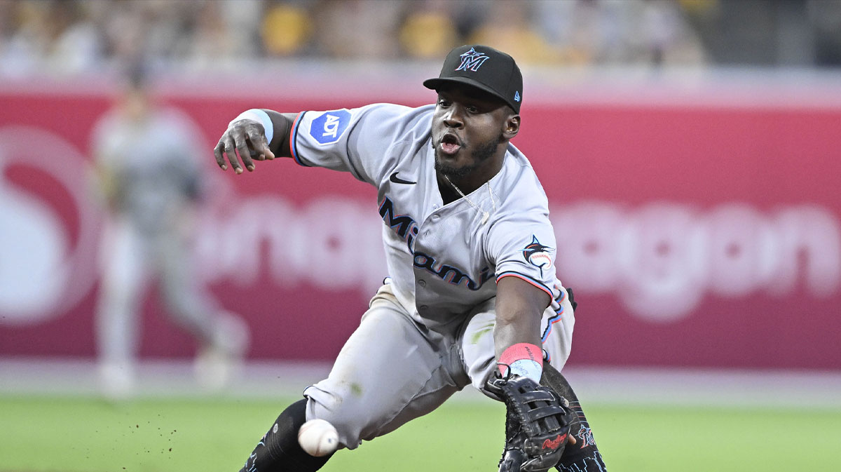 Miami Marlins second baseman Ronny Simon (41) can’t make the stop on a ball hit by San Diego Padres shortstop Xander Bogaerts (2) during the third inning at Petco Park. Simon was charged with an error on the play.