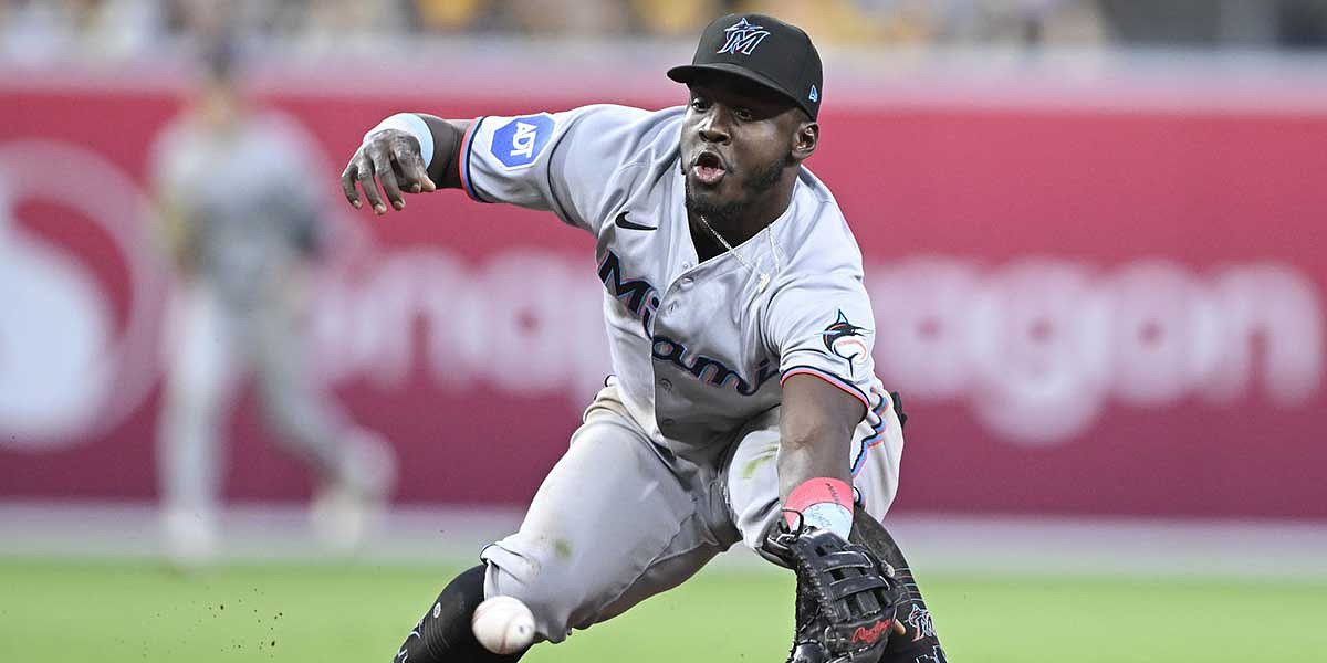 Miami Marlins second baseman Ronny Simon (41) can’t make the stop on a ball hit by San Diego Padres shortstop Xander Bogaerts (2) during the third inning.