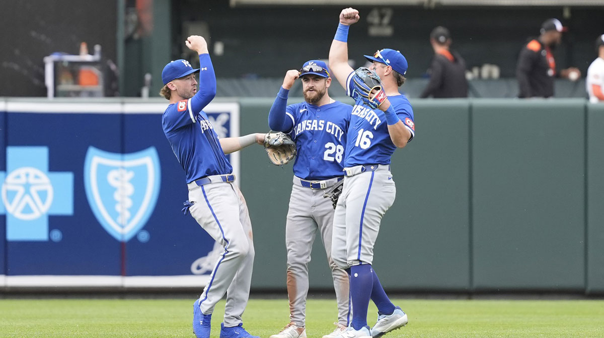 Kansas City Royals center fielder Drew Waters (8) and center fielder Kyle Isbel (28) and right fielder Hunter Renfroe (16) celebrate the victory against the Baltimore Orioles after the ninth inning at Oriole Park at Camden Yards.