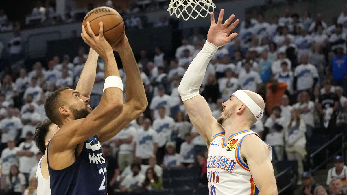 Minnesota Timberwolves center Rudy Gobert (27) shoots the ball over Oklahoma City Thunder guard Alex Caruso (9) in the second half during game four of the western conference finals for the 2025 NBA Playoffs at Target Center.