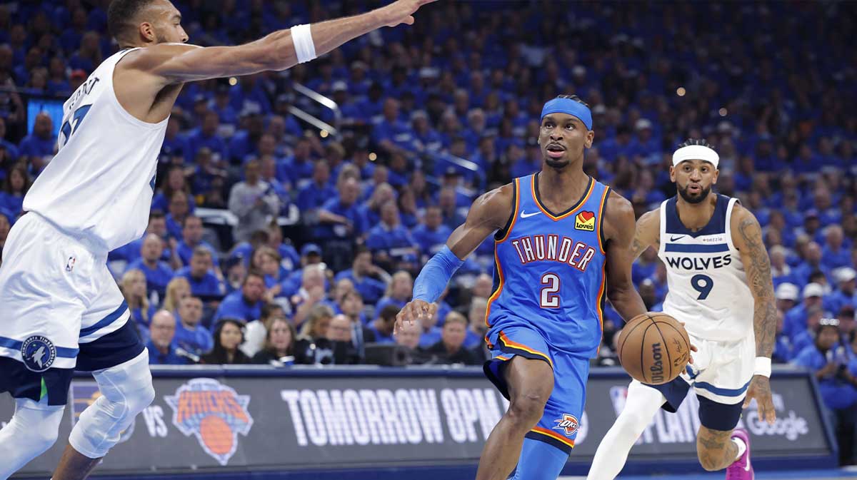Oklahoma City Thunder guard Shai Gilgeous-Alexander (2) drives against Minnesota Timberwolves center Rudy Gobert (27) in the first quarter during game two of the western conference finals for the 2025 NBA Playoffs at Paycom Center.