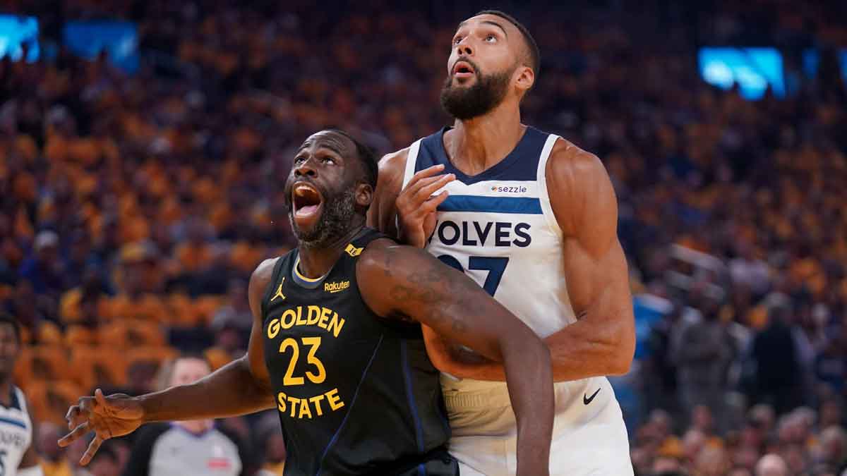 Golden State Warriors forward Draymond Green (23) battles for position with Minnesota Timberwolves center Rudy Gobert (27) in the first quarter during game four of the second round for the 2025 NBA Playoffs at Chase Center.