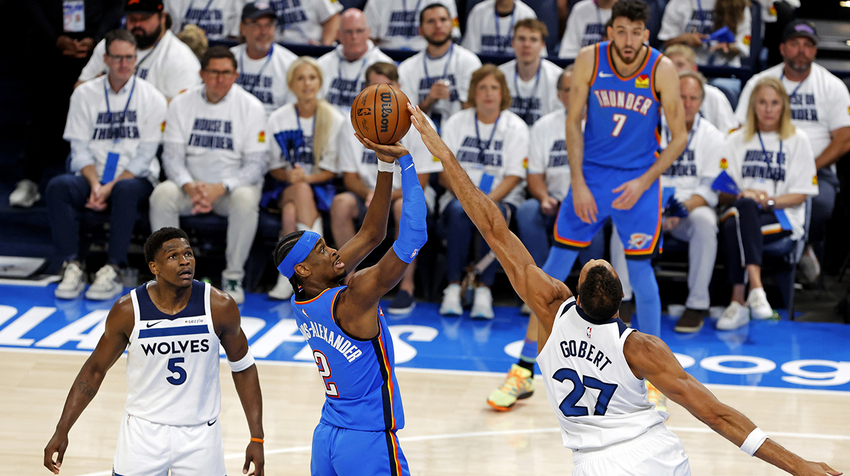 Oklahoma City Thunder guard Shai Gilgeous-Alexander (2) shoots the ball against Minnesota Timberwolves center Rudy Gobert (27) during the first quarter in game five of the western conference finals for the 2025 NBA Playoffs at Paycom Center.