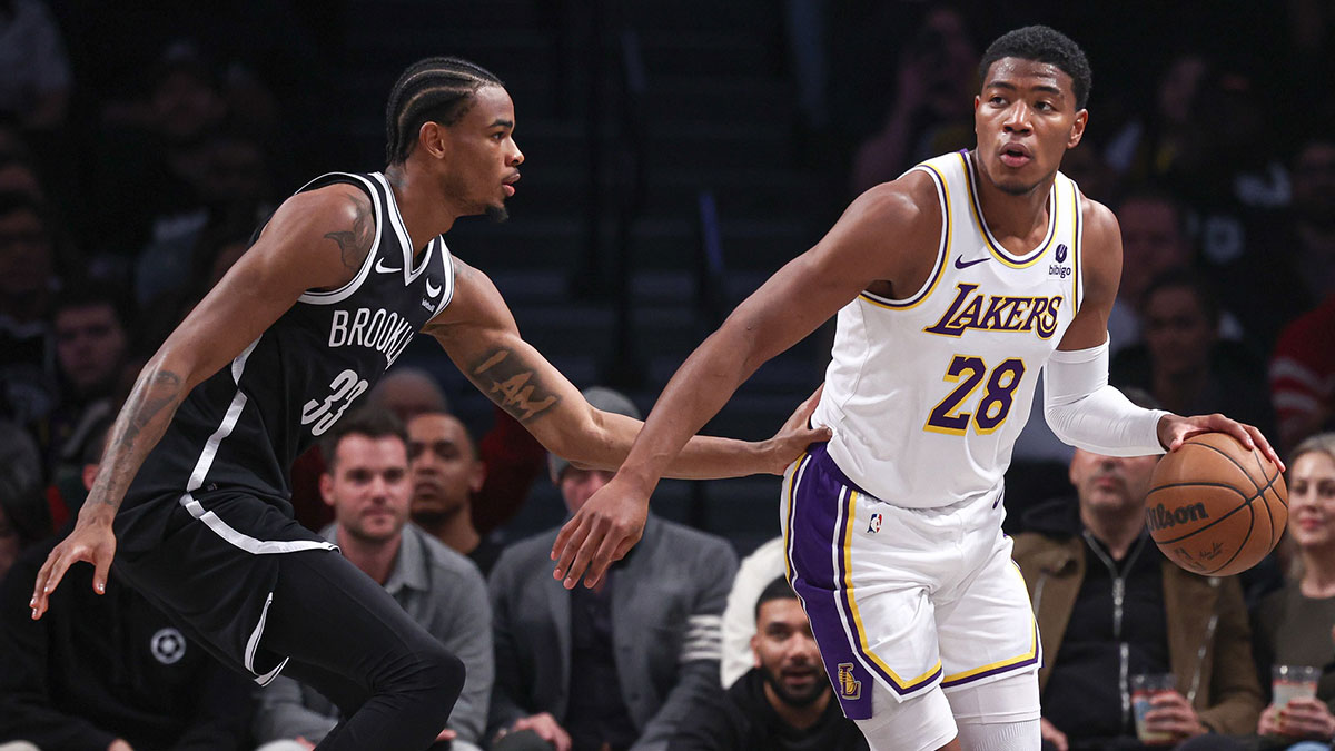 Los Angeles Lakers forward Rui Hachimura (28) dribbles against Brooklyn Nets center Nic Claxton (33) during the first half at Barclays Center.