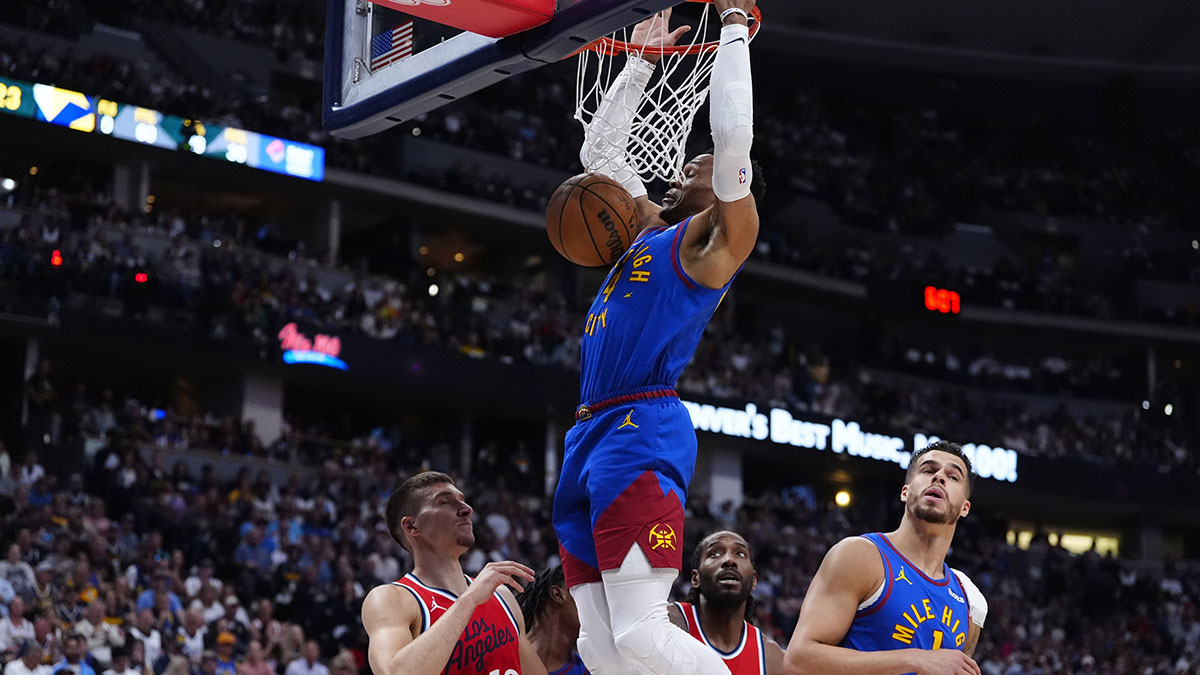 Denver Nuggets guard Russell Westbrook (4) finishes off a basket over LA Clippers guard Bogdan Bogdanovic (10) in the second quarter during game seven of first round for the 2025 NBA Playoffs at Ball Arena.