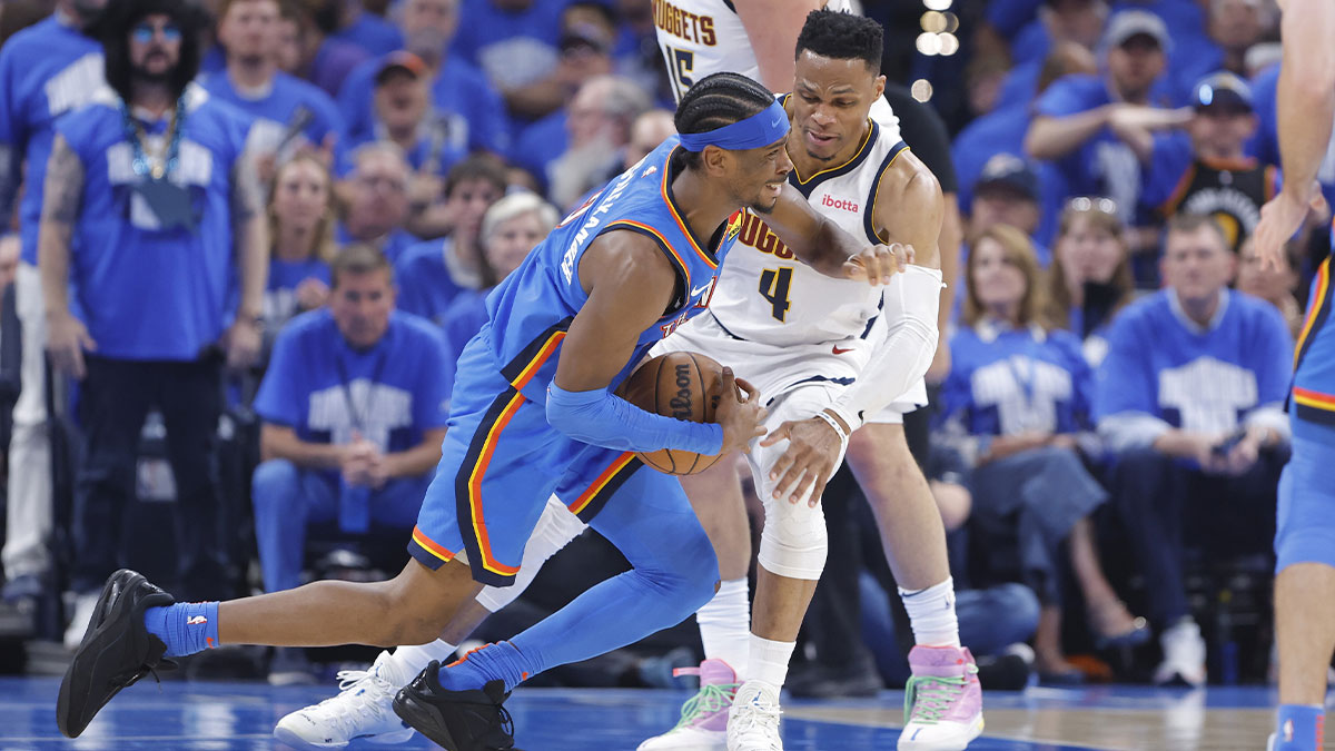 Oklahoma City Thunder guard Shai Gilgeous-Alexander (2) is fouled by Denver Nuggets guard Russell Westbrook (4) on a drive in the second quarter during game seven of the second round for the 2025 NBA Playoffs at Paycom Center.
