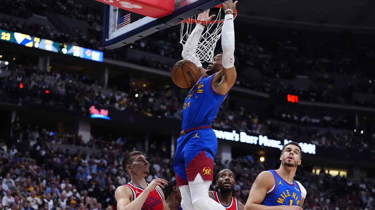 Denver Nuggets guard Russell Westbrook (4) finishes off a basket over LA Clippers guard Bogdan Bogdanovic (10) in the second quarter during game seven of first round for the 2025 NBA Playoffs at Ball Arena.