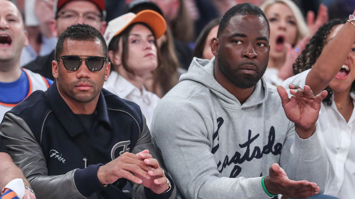 New York Giants quarterback Russell Wilson, who was hyped up after the Game 2 win over the Boston Celtics, and Justin Tuck at New York Knicks-Detroit Pistons game.