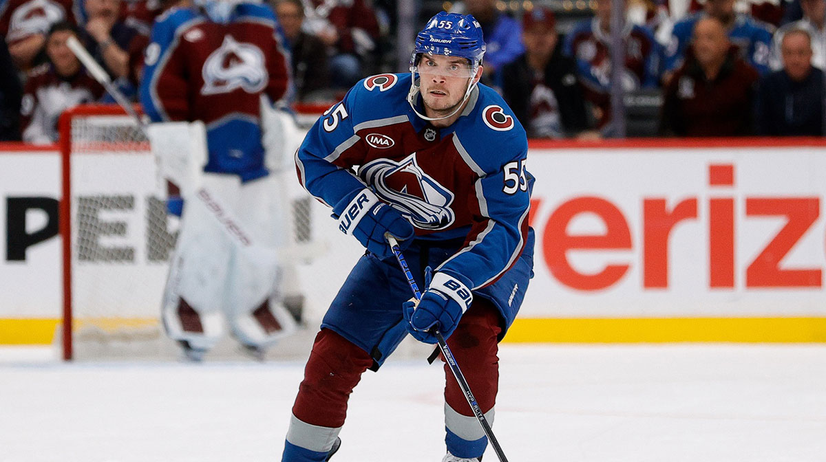 Colorado Avalanche defenseman Ryan Lindgren (55) controls the puck in the second period against the Dallas Stars in game three of the first round of the 2025 Stanley Cup Playoffs at Ball Arena.