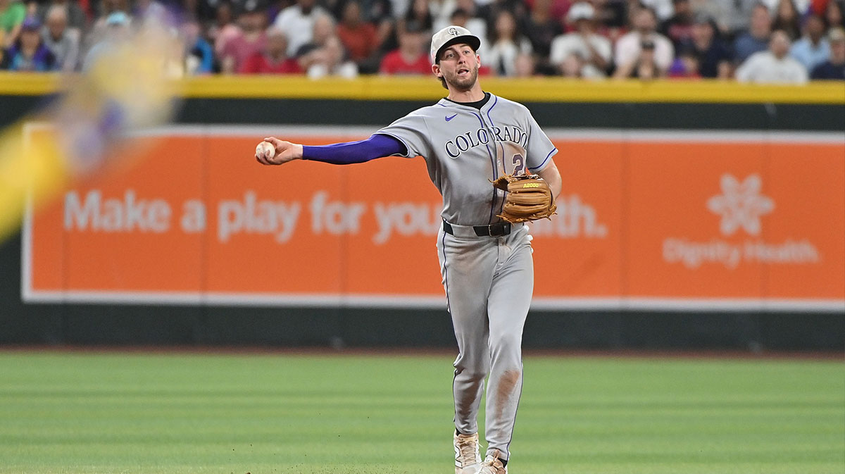 Colorado Rockies third base Ryan McMahon (24) throws to first base in the fifth inning against the Arizona Diamondbacks at Chase Field.
