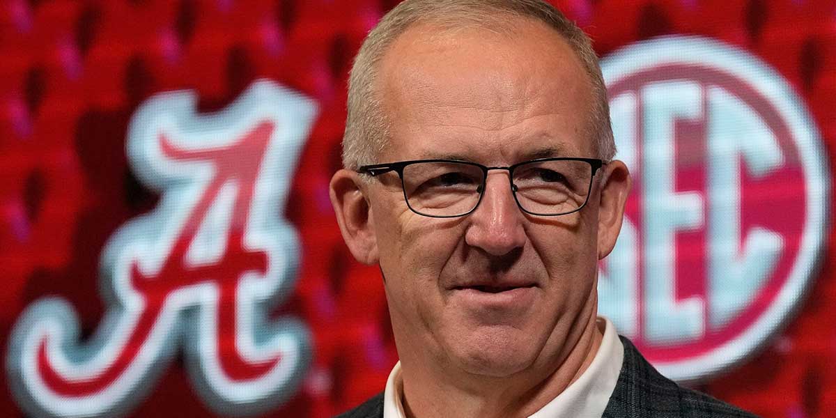 SEC Commissioner Greg Sankey introduces Alabama coach Kirsty Curry during SEC Media Day.