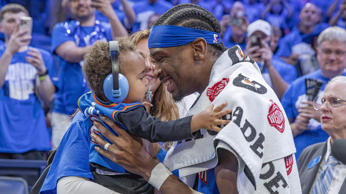 Oklahoma City Thunder guard Shai Gilgeous-Alexander (2) hugs his son and wife after his team defeated the Denver Nuggets in game seven of the second round for the 2025 NBA Playoffs at Paycom Center.