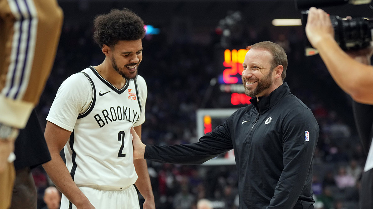 Brooklyn Nets forward Cameron Johnson (2) and assistant coach Steve Hetzel (right) talk during the second quarter against the Sacramento Kings at Golden 1 Center.