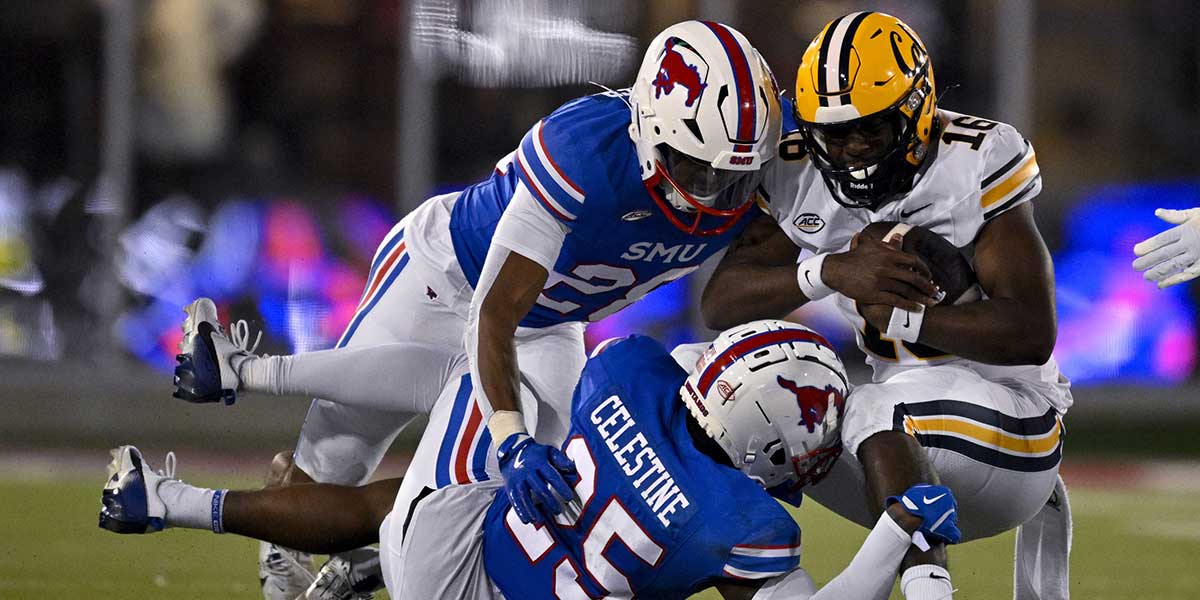 California Golden Bears quarterback CJ Harris (16) and Southern Methodist Mustangs linebacker Brandon Booker (28) and safety Davaughn Celestine (25) in action during the game between the SMU Mustangs and the California Golden Bears at Gerald J. Ford Stadium. Mandatory Credit: Jerome Miron-Imagn Images