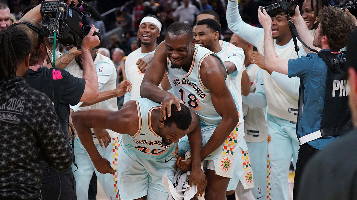 San Antonio Spurs center Bismack Biyombo (18) celebrates with San Antonio Spurs forward Harrison Barnes (40) after Barnes made the game-winning shot in the fourth quarter against the Golden State Warriors at Chase Center.