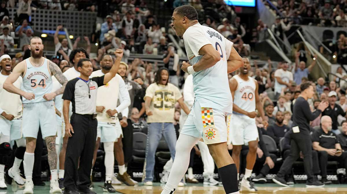 San Antonio Spurs forward Keldon Johnson (0) and teammates react after drawing a foul on a basket during the second half against the Toronto Raptors at Frost Bank Center.