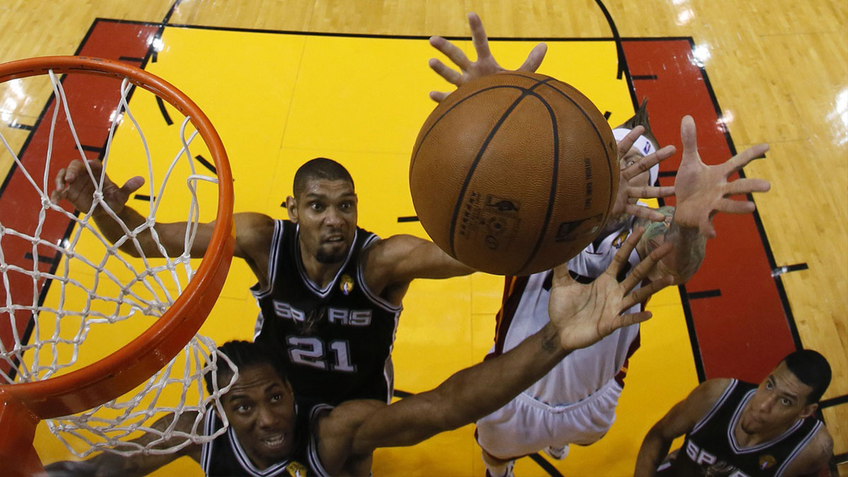 San Antonio Spurs power forward Tim Duncan (21) rebounds against Miami Heat power forward Chris Andersen (11) during the first quarter of game six in the 2013 NBA Finals at American Airlines Arena.