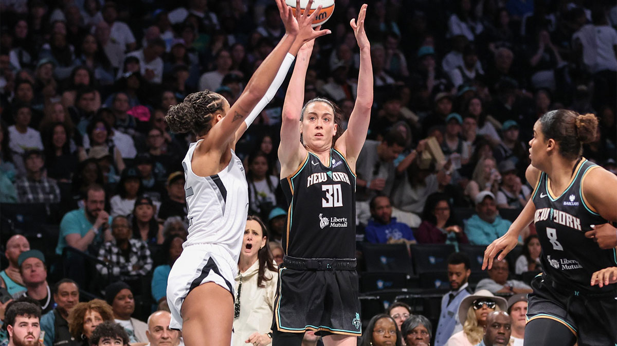 May 17, 2025; Brooklyn, New York, USA; New York Liberty forward Breanna Stewart (30) takes a three point shot past Las Vegas Aces center A'ja Wilson (22) in the third quarter at Barclays Center. Mandatory Credit: Wendell Cruz-Imagn Images