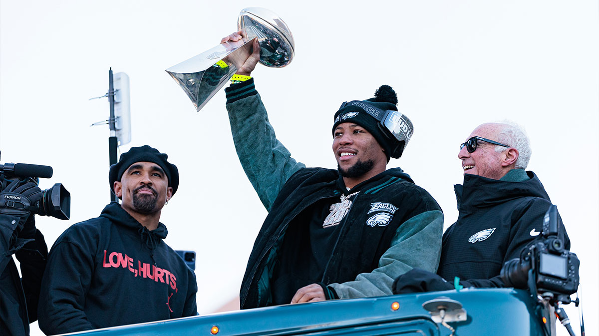 Philadelphia Eagles running back Saquon Barkley (26) lifts the Lombardi Trophy during the Super Bowl LIX championship parade and rally.