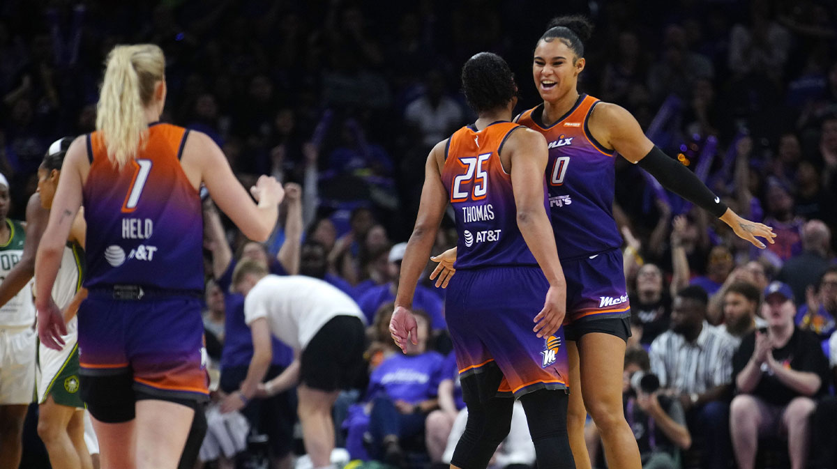 Phoenix Mercury forwards Satou Sabally (0) and Alyssa Thomas (25) and guard Lexi Held (1) celebrate after forcing a Seattle Storm timeout during the Mercury home opener in the PHX Arena in Phoenix on May 17, 2025.