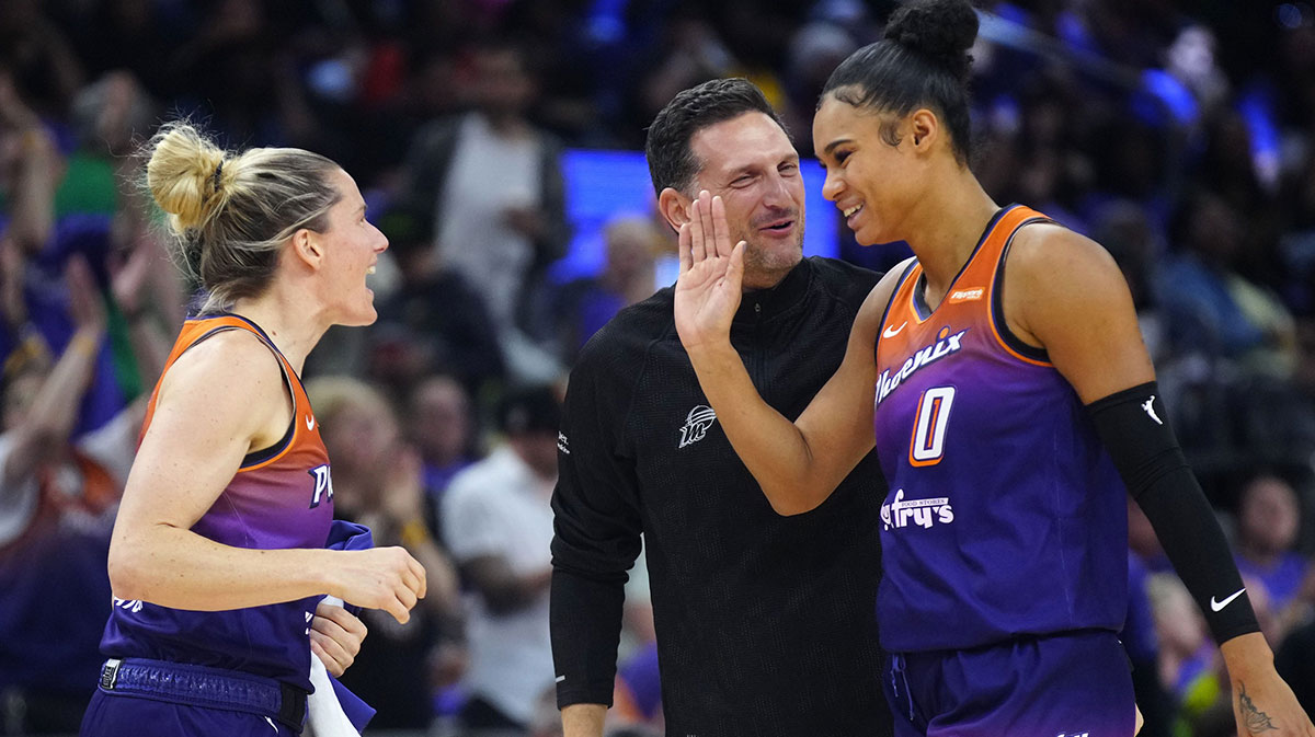 Phoenix Mercury head coach Nate Tibbetts celebrates with forward Satou Sabally (0) and Sami Whitcomb (33) during the Mercury home opener against the Seattle Storm in the PHX Arena in Phoenix on May 17, 2025.