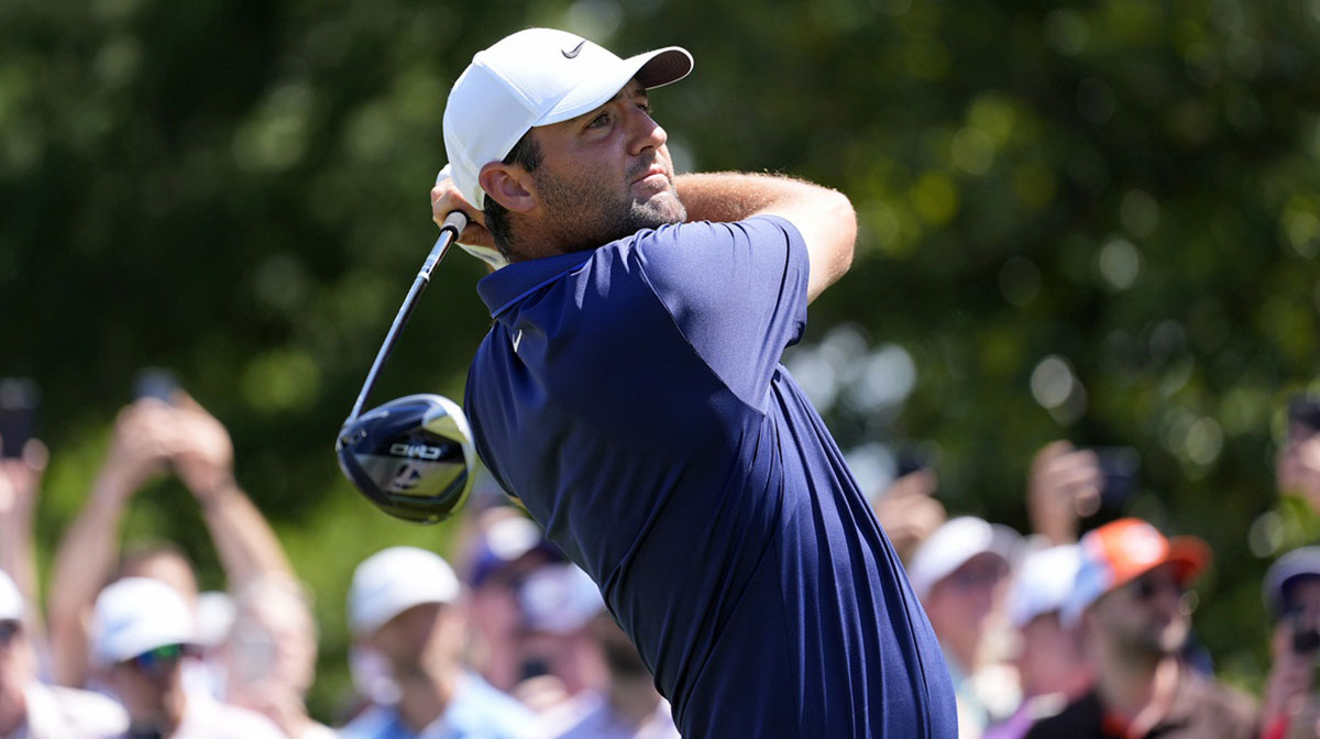 Scottie Scheffler tees off on the third hole during the final round of the PGA Championship golf tournament at Quail Hollow.