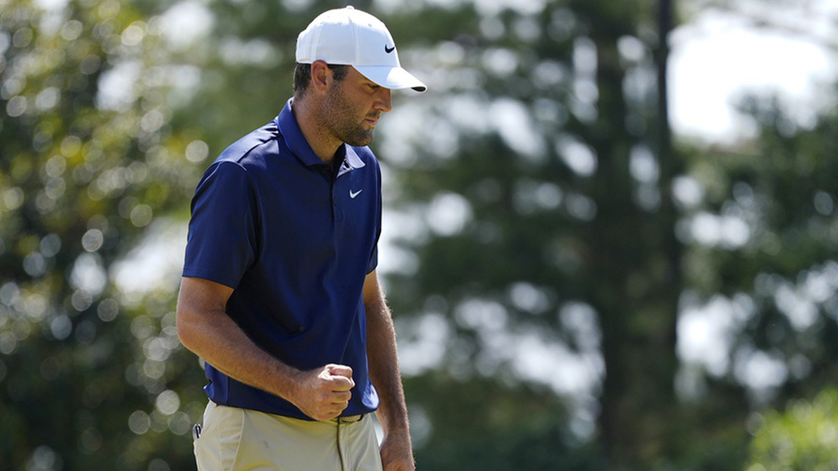 Scottie Scheffler reacts after a putt fifth green during the final round of the PGA Championship golf tournament at Quail Hollow.