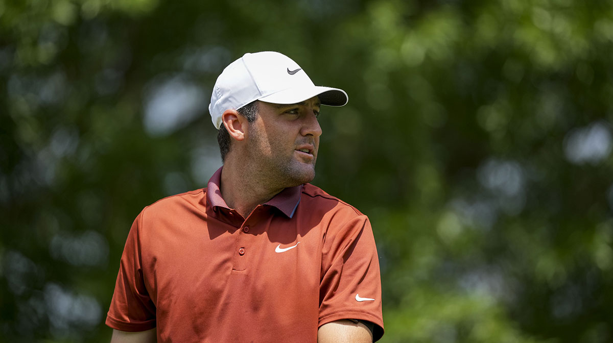 Scottie Scheffler tees off at the second hole during the first round of the PGA Championship golf tournament at Quail Hollow.