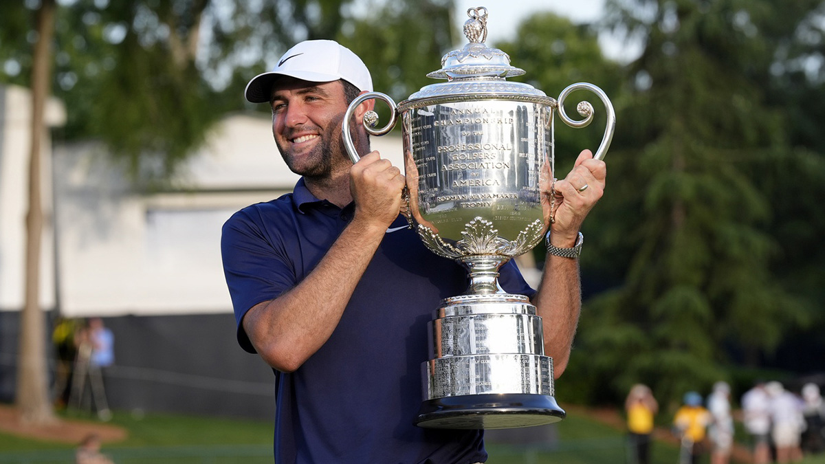 Scottie Scheffler holds the Wanamaker Trophy after winning the PGA Championship golf tournament at Quail Hollow.