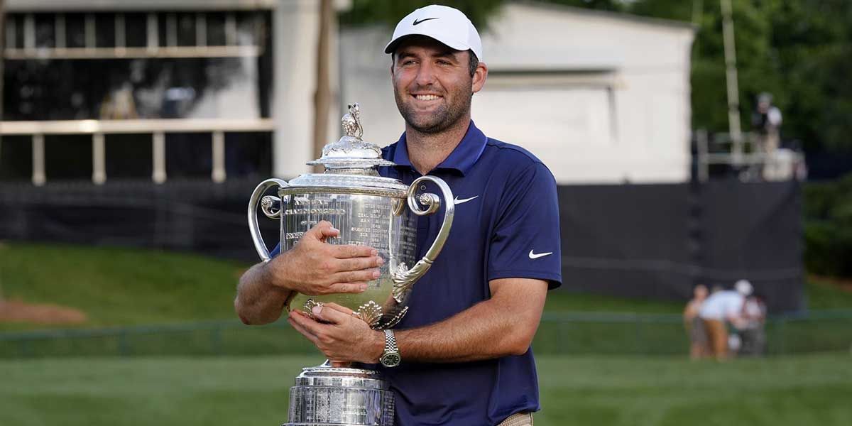 Scottie Scheffler holds the Wanamaker Trophy after winning the PGA Championship golf tournament at Quail Hollow.
