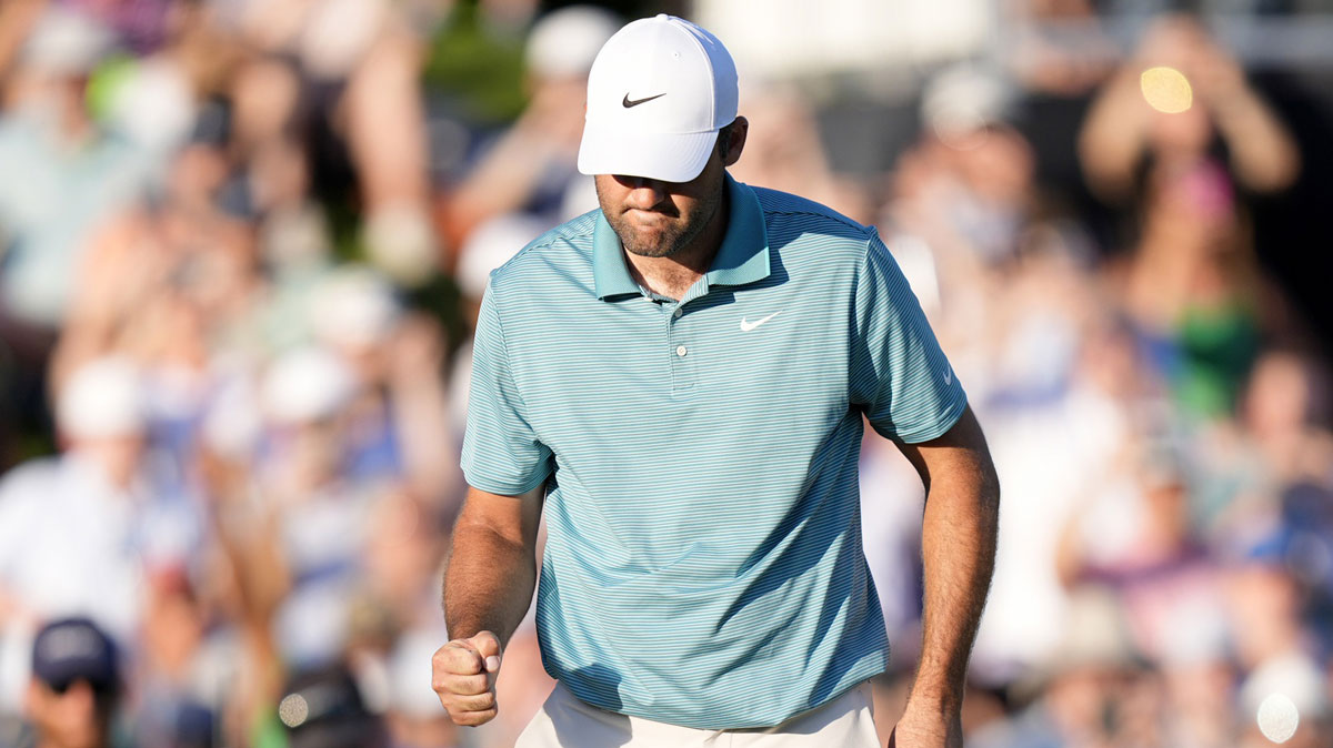 Scottie Scheffler reacts after a putt on the 18th green during the third round of the PGA Championship golf tournament at Quail Hollow.