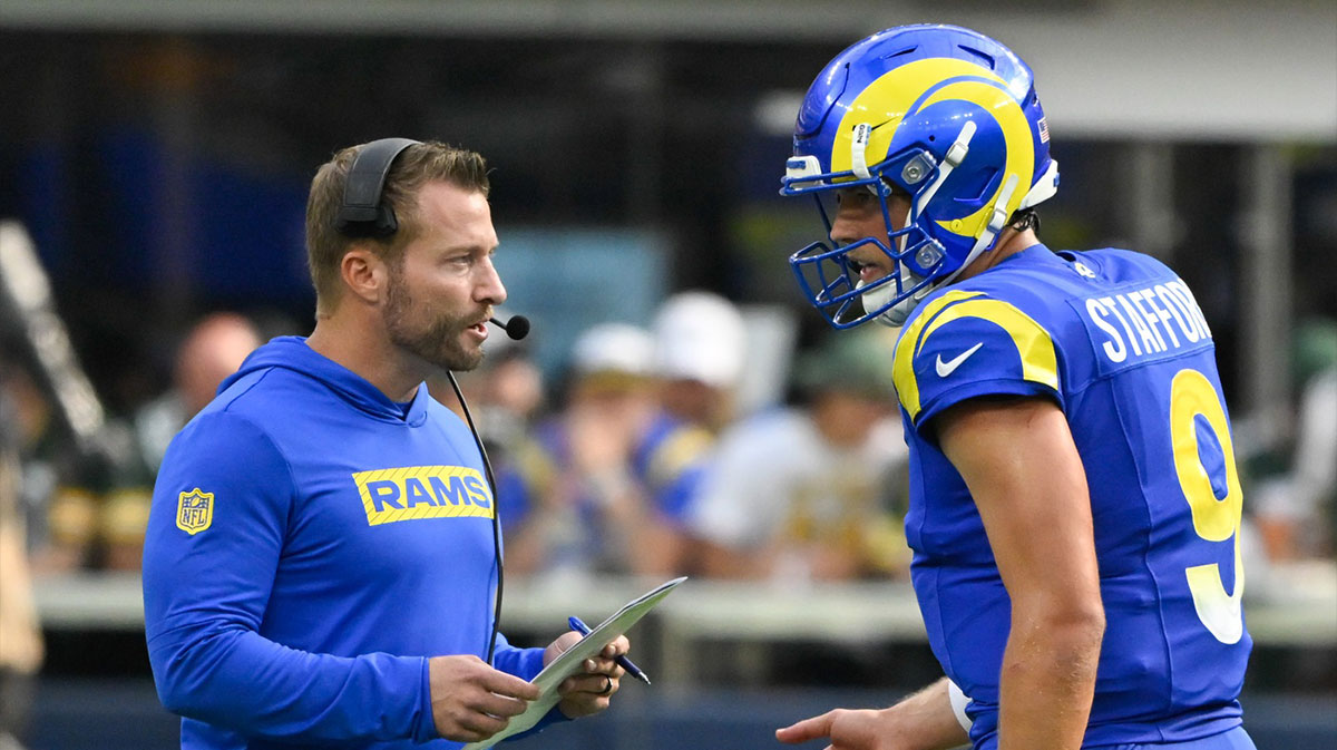 Los Angeles Rams head coach Sean McVay talks to quarterback Matthew Stafford (9) during the third quarter against the Green Bay Packers at SoFi Stadium.