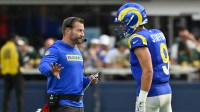 Los Angeles Rams head coach Sean McVay talks to quarterback Matthew Stafford (9) during the third quarter against the Green Bay Packers at SoFi Stadium.