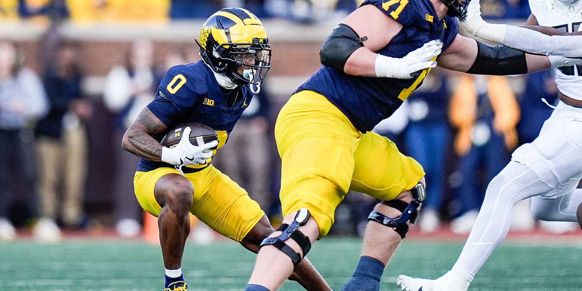 Michigan wide receiver Semaj Morgan (0) runs against Oregon after making a catch during the first half at Michigan Stadium