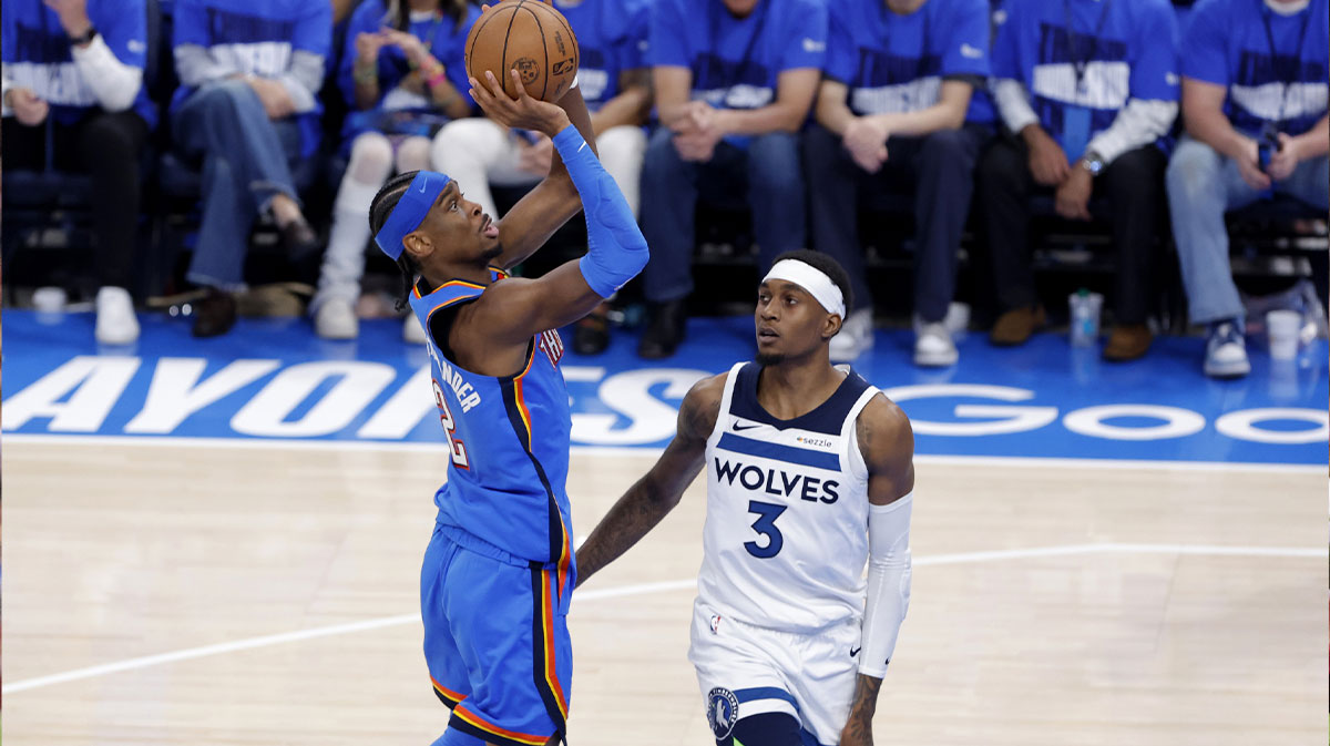 Oklahoma City Thunder guard Shai Gilgeous-Alexander (2) shoots against Minnesota Timberwolves forward Jaden McDaniels (3) in the fourth quarter during game two of the western conference finals for the 2025 NBA Playoffs at Paycom Center.