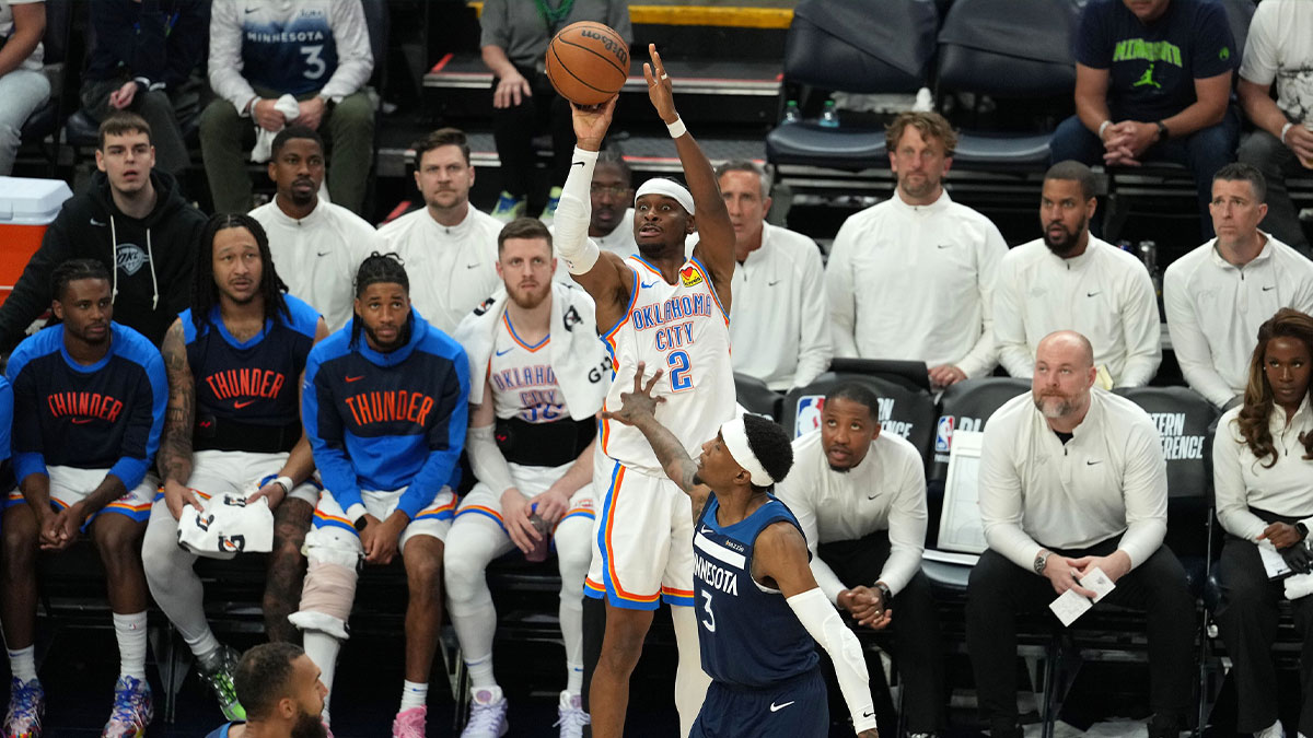 Oklahoma City Thunder guard Shai Gilgeous-Alexander (2) shoots the ball against Minnesota Timberwolves forward Jaden McDaniels (3) in the second half during game four of the western conference finals for the 2025 NBA Playoffs at Target Center.