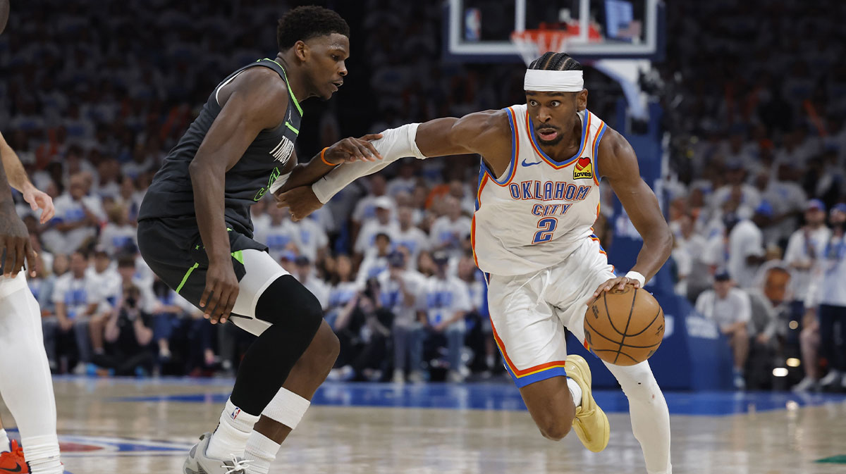 Oklahoma City Thunder guard Shai Gilgeous-Alexander (2) drives against Minnesota Timberwolves guard Anthony Edwards (5) in the fourth quarter during game one of the western conference finals for the 2025 NBA Playoffs at Paycom Center.