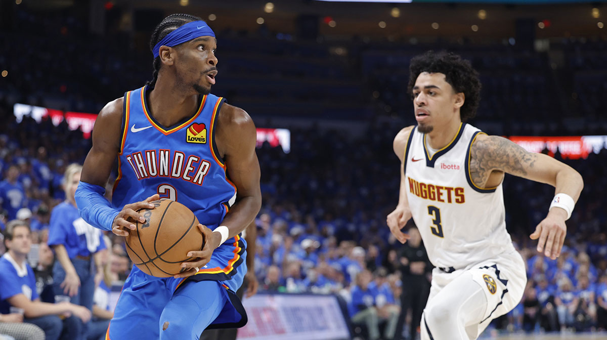Oklahoma City Thunder guard Shai Gilgeous-Alexander (2) moves the ball down the court beside Denver Nuggets guard Julian Strawther (3) in the second half of game seven of the second round for the 2025 NBA Playoffs at Paycom Center.