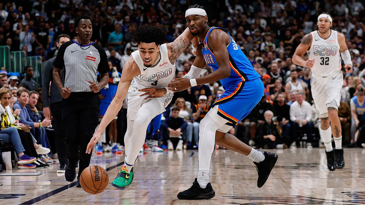 Denver Nuggets guard Julian Strawther (3) controls the ball as Oklahoma City Thunder guard Shai Gilgeous-Alexander (2) guards in the fourth quarter during game six of the second round for the 2025 NBA Playoffs at Ball Arena.
