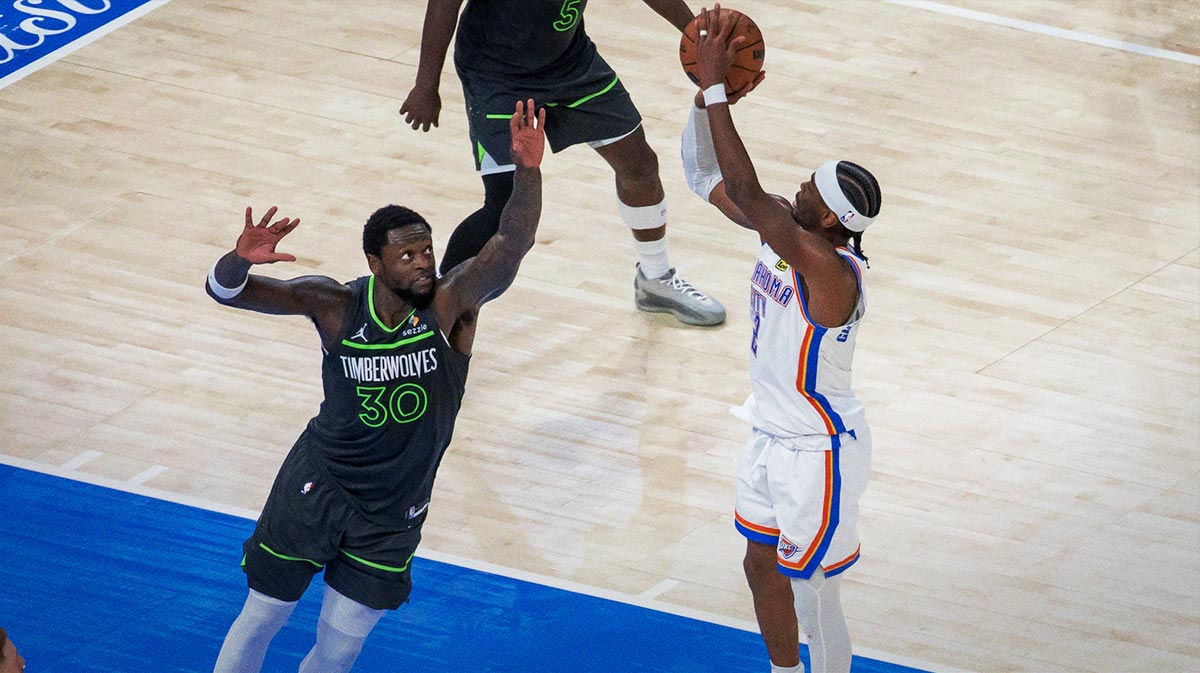 Oklahoma City Thunder guard Shai Gilgeous-Alexander (2) shoots against Minnesota Timberwolves forward Julius Randle (30) in the fourth quarter during game one of the western conference finals for the 2025 NBA Playoffs at Paycom Center.