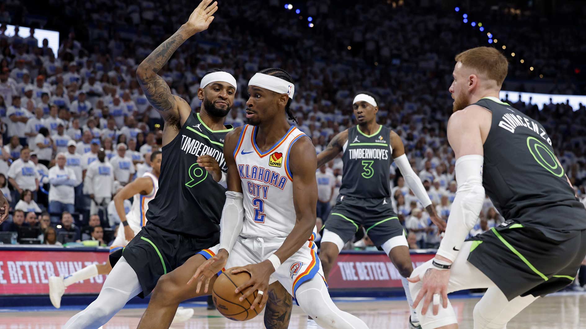 Oklahoma City Thunder guard Shai Gilgeous-Alexander (2) drives against Minnesota Timberwolves guard Nickeil Alexander-Walker (9) in the fourth quarter during game one of the western conference finals for the 2025 NBA Playoffs at Paycom Center.
