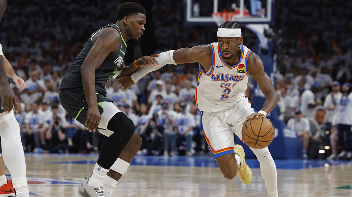Oklahoma City Thunder guard Shai Gilgeous-Alexander (2) drives against Minnesota Timberwolves guard Anthony Edwards (5) in the fourth quarter during game one of the western conference finals for the 2025 NBA Playoffs at Paycom Center.