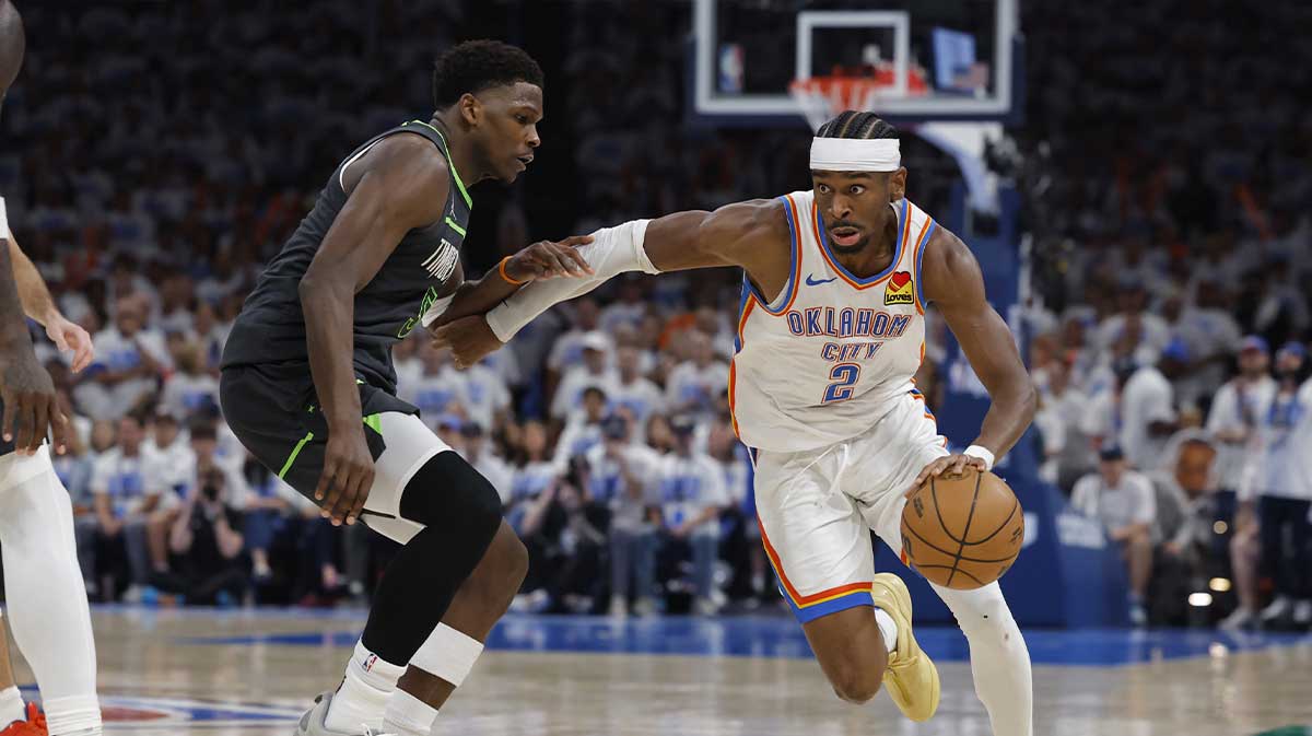 Oklahoma City Thunder guard Shai Gilgeous-Alexander (2) drives against Minnesota Timberwolves guard Anthony Edwards (5) in the fourth quarter during game one of the western conference finals for the 2025 NBA Playoffs at Paycom Center.
