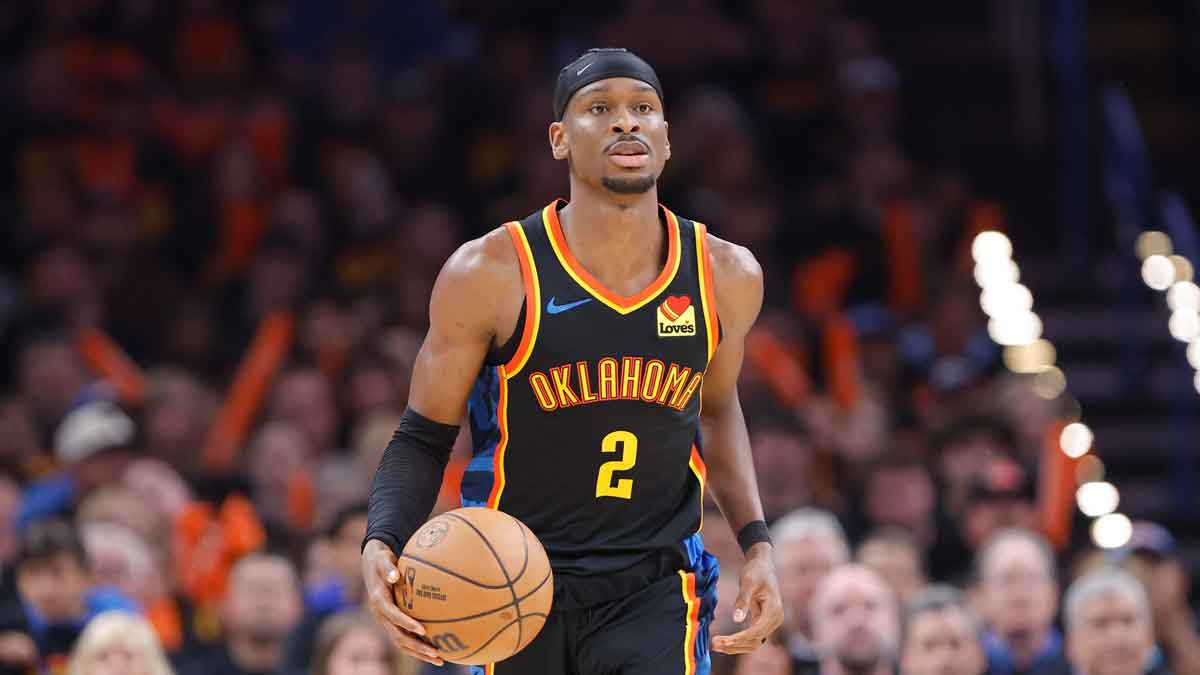 Oklahoma City Thunder guard Shai Gilgeous-Alexander (2) dribbles down the court against the Denver Nuggets during the second half during game one of the second round for the 2025 NBA Playoffs at Paycom Center.