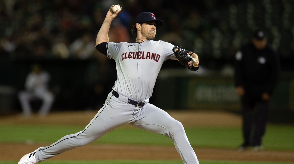 Cleveland Guardians starting pitcher Shane Bieber (57) delivers a pitch against the Oakland Athletics during the third inning at Oakland-Alameda County Coliseum