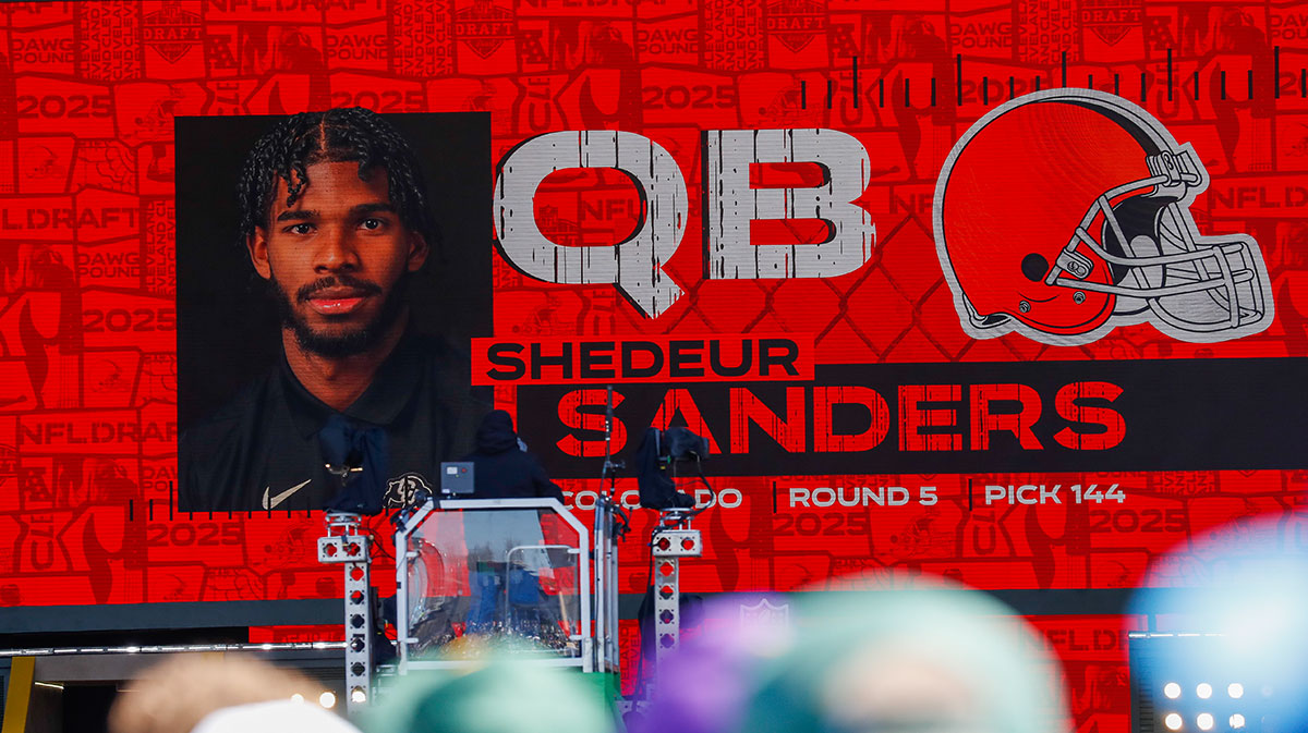 A graphic announcing Colorado quarterback Shedeur Sanders’ selection by the Cleveland Browns with the 144th overall pick is seen in the Draft Theater during the third day of the 2025 NFL Draft at Lambeau Field.
